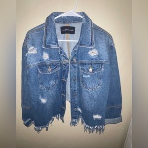 Distressed jean jacket- cropped in back